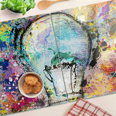 Tocător sticlă Bec pe un fundal colorat