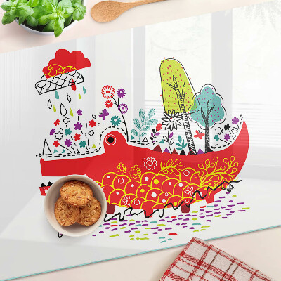 Tocător din sticlă Crocodil într-un decor colorat