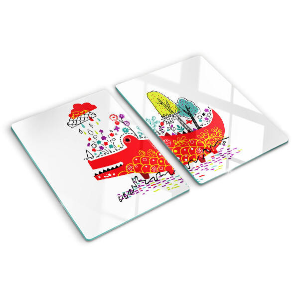 Tocător din sticlă Crocodil într-un decor colorat