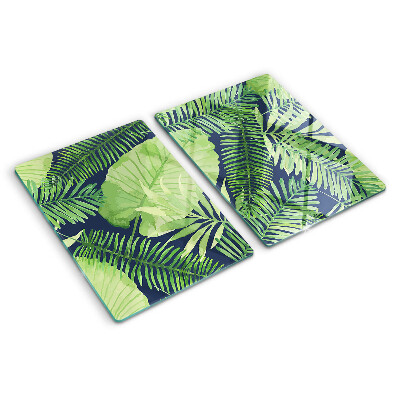 Tocător din sticlă Frunze tropicale pe un fundal întunecat