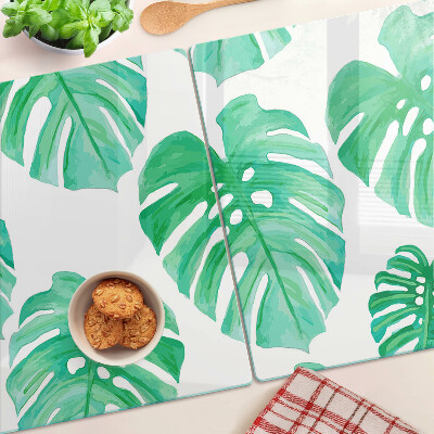 Tocător din sticlă Frunze de Monstera pe fundal alb