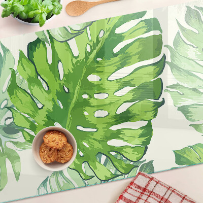 Tocător sticlă Frunze de Monstera pe un fundal deschis