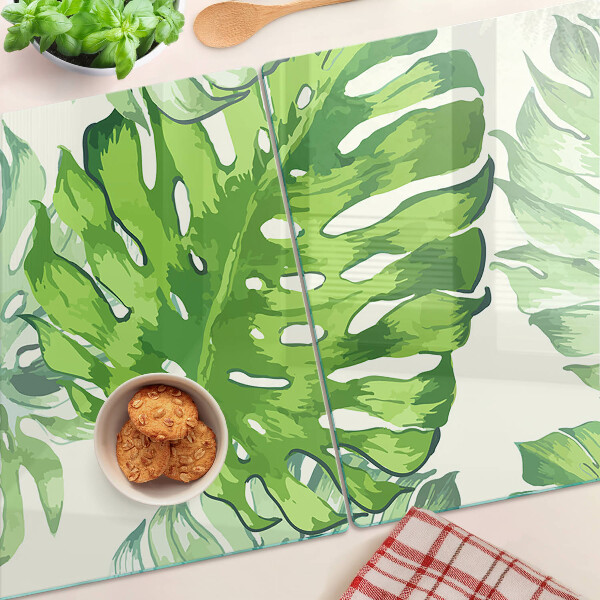 Tocător sticlă Frunze de Monstera pe un fundal deschis