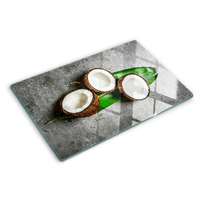 Tocător de bucătărie Nucă de cocos pe un fundal de beton
