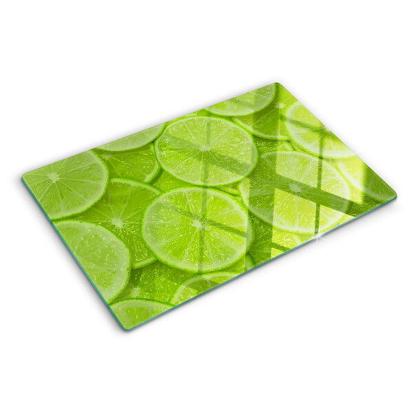 Tocător sticlă Felii de lime pe fundal verde