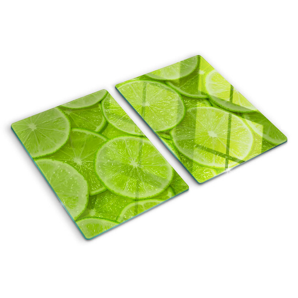Tocător sticlă Felii de lime pe fundal verde