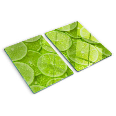 Tocător sticlă Felii de lime pe fundal verde
