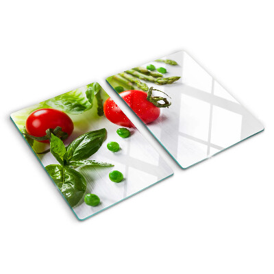 Tocător sticlă Legume pe un blat alb