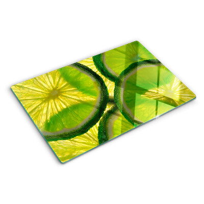 Tocător sticlă Felii de lime pe fundal verde