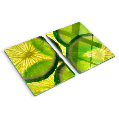 Tocător sticlă Felii de lime pe fundal verde