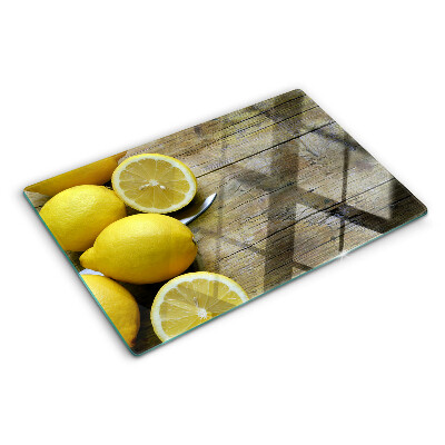 Tocător sticlă Lămâi pe un fundal de lemn