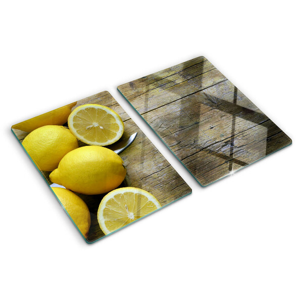 Tocător sticlă Lămâi pe un fundal de lemn