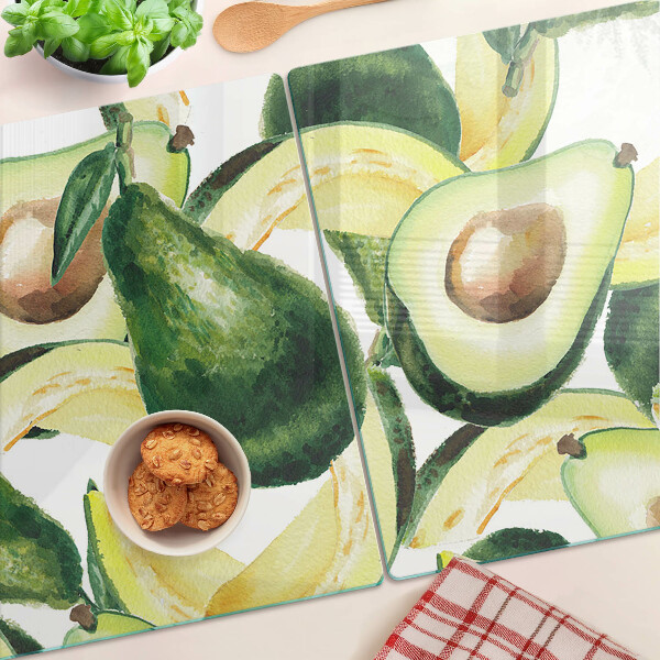 Tocător din sticlă Avocado cu frunze în fundal