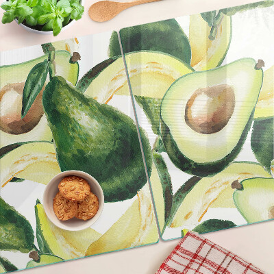 Tocător din sticlă Avocado cu frunze în fundal