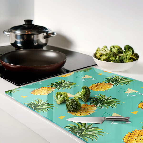 Tocător din sticlă Ananas pe un fundal turcoaz