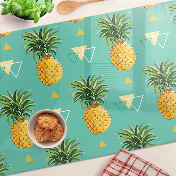 Tocător din sticlă Ananas pe un fundal turcoaz