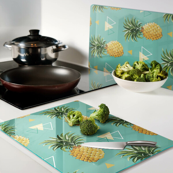Tocător din sticlă Ananas pe un fundal turcoaz