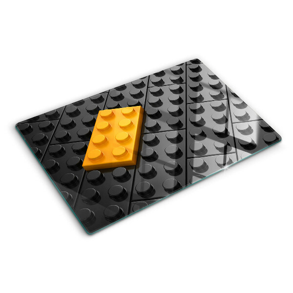 Tocător din sticlă Cărămizi LEGO pe fundal negru