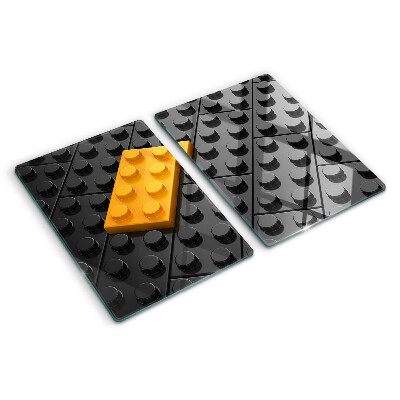 Tocător din sticlă Cărămizi LEGO pe fundal negru