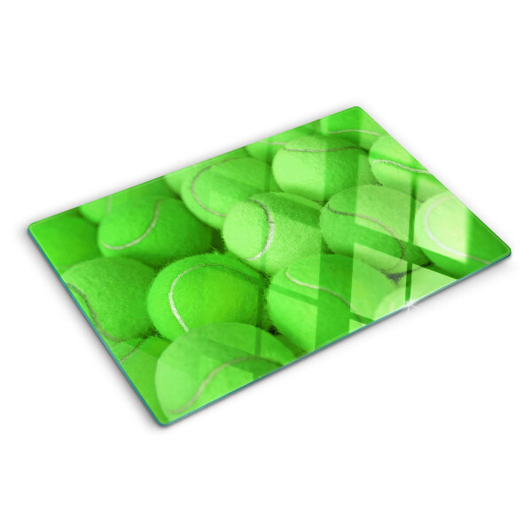 Tocător sticlă Mingi de tenis pe un fundal verde