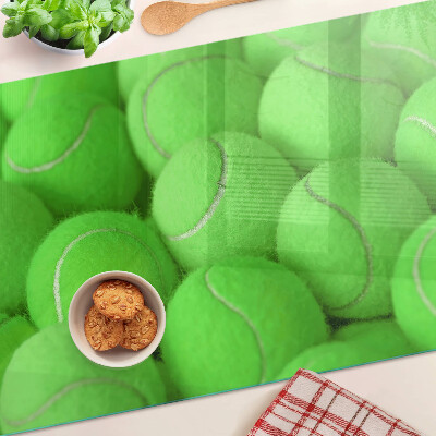 Tocător sticlă Mingi de tenis pe un fundal verde
