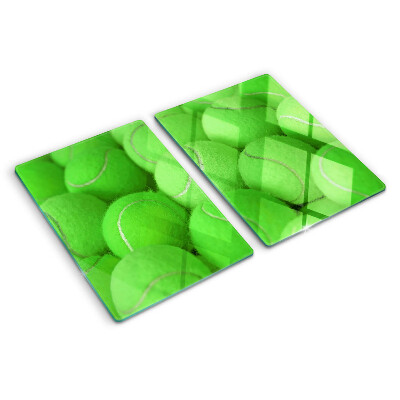 Tocător sticlă Mingi de tenis pe un fundal verde