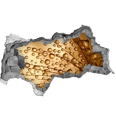 Autocolant autoadeziv gaură O picătură aurie pe fundalul de beton