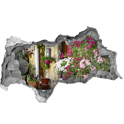 Autocolant un zid spart cu priveliște Un colț de flori în oraș