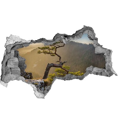 Fototapet un zid spart cu priveliște Peisaj montan cu un copac