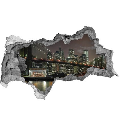 Autocolant un zid spart cu priveliște New York noaptea printr-o gaură în perete