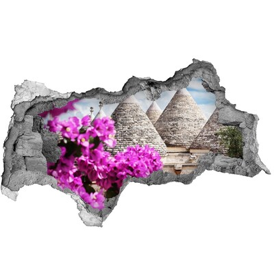 Fototapet 3D gaură în perete Trulli în Puglia cu flori