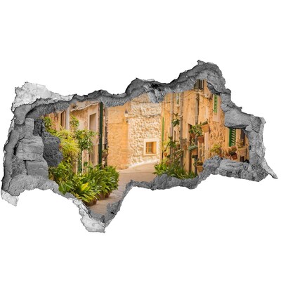 Fototapet un zid spart cu priveliște O stradă fermecătoare din oraș