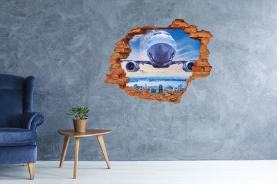 Autocolant gaură 3D Un avion deasupra orașului