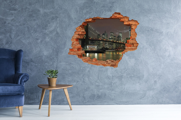 Fototapet un zid spart cu priveliște New York noaptea printr-o gaură în perete