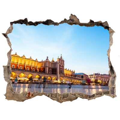 Autocolant un zid spart cu priveliște Cracovia la apus