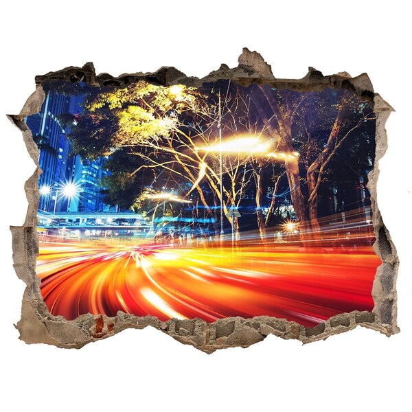 Fototapet un zid spart cu priveliște Un oraș în mișcare noaptea