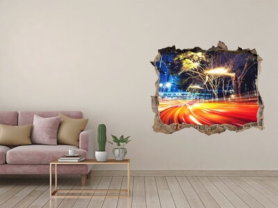 Fototapet un zid spart cu priveliște Un oraș în mișcare noaptea